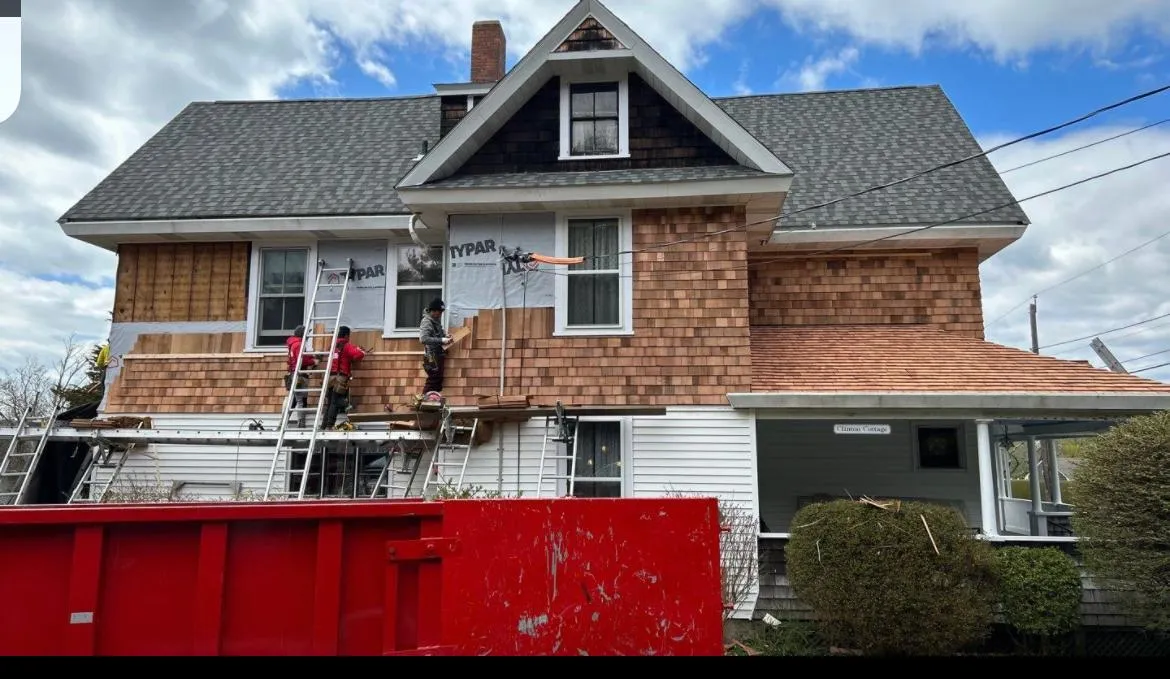 Vinyl siding installation on a Rhode Island home exterior