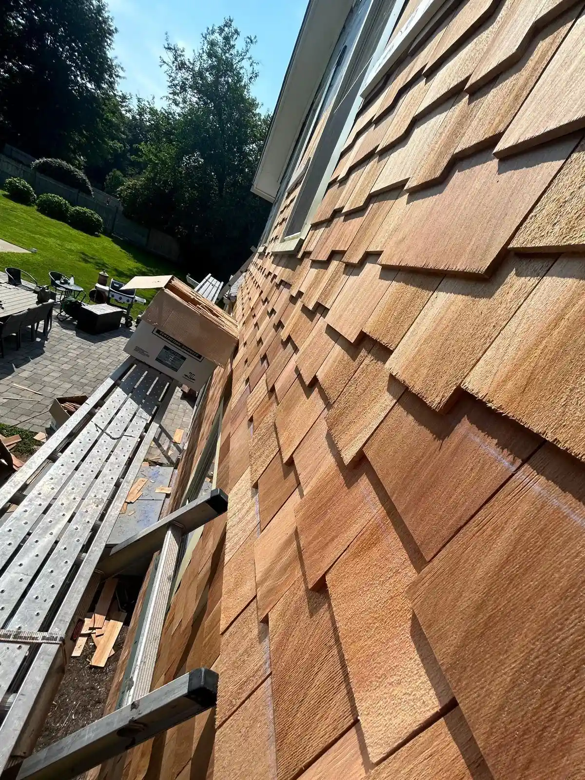 Damaged siding panel on a Rhode Island home exterior