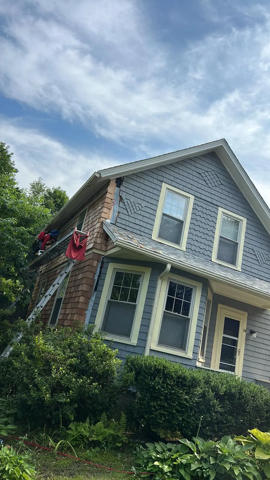 Exterior siding upgrade with new trim on a Rhode Island home