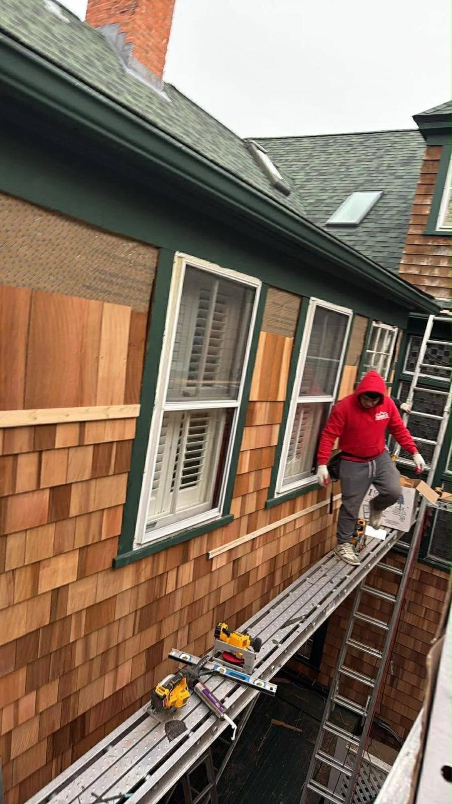 Siding replacement on a mill era multi family building in Woonsocket, RI