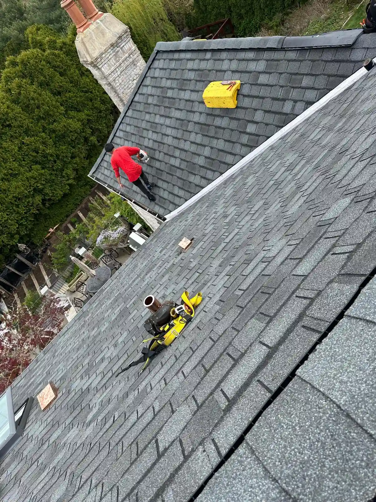 Roofing crew working on a Rhode Island home exterior