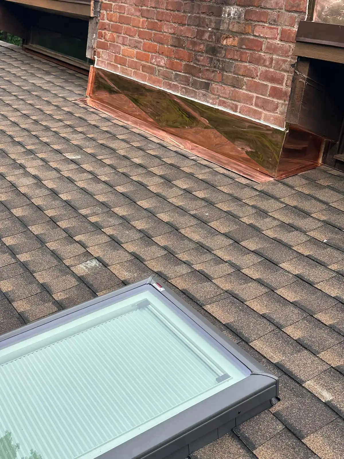 Completed asphalt shingle roof on a residential property in Rhode Island