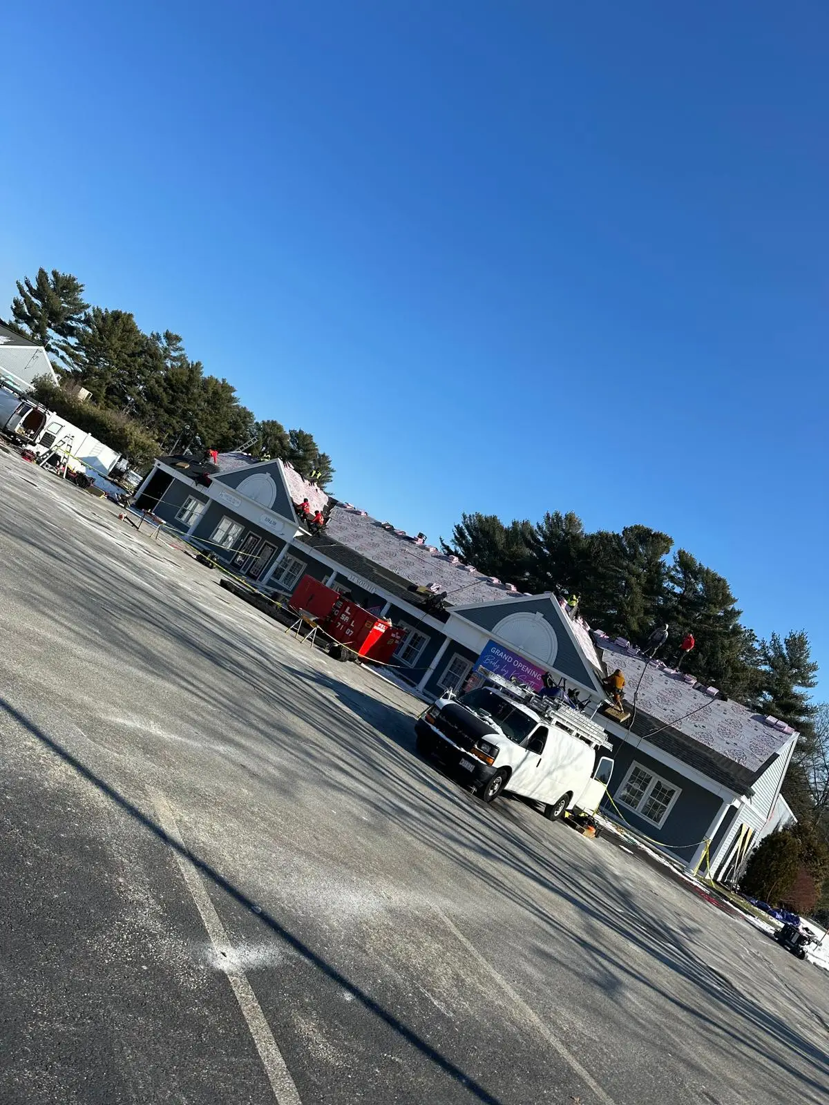 Roofing crew replacing a roof deck on a home in Rhode Island