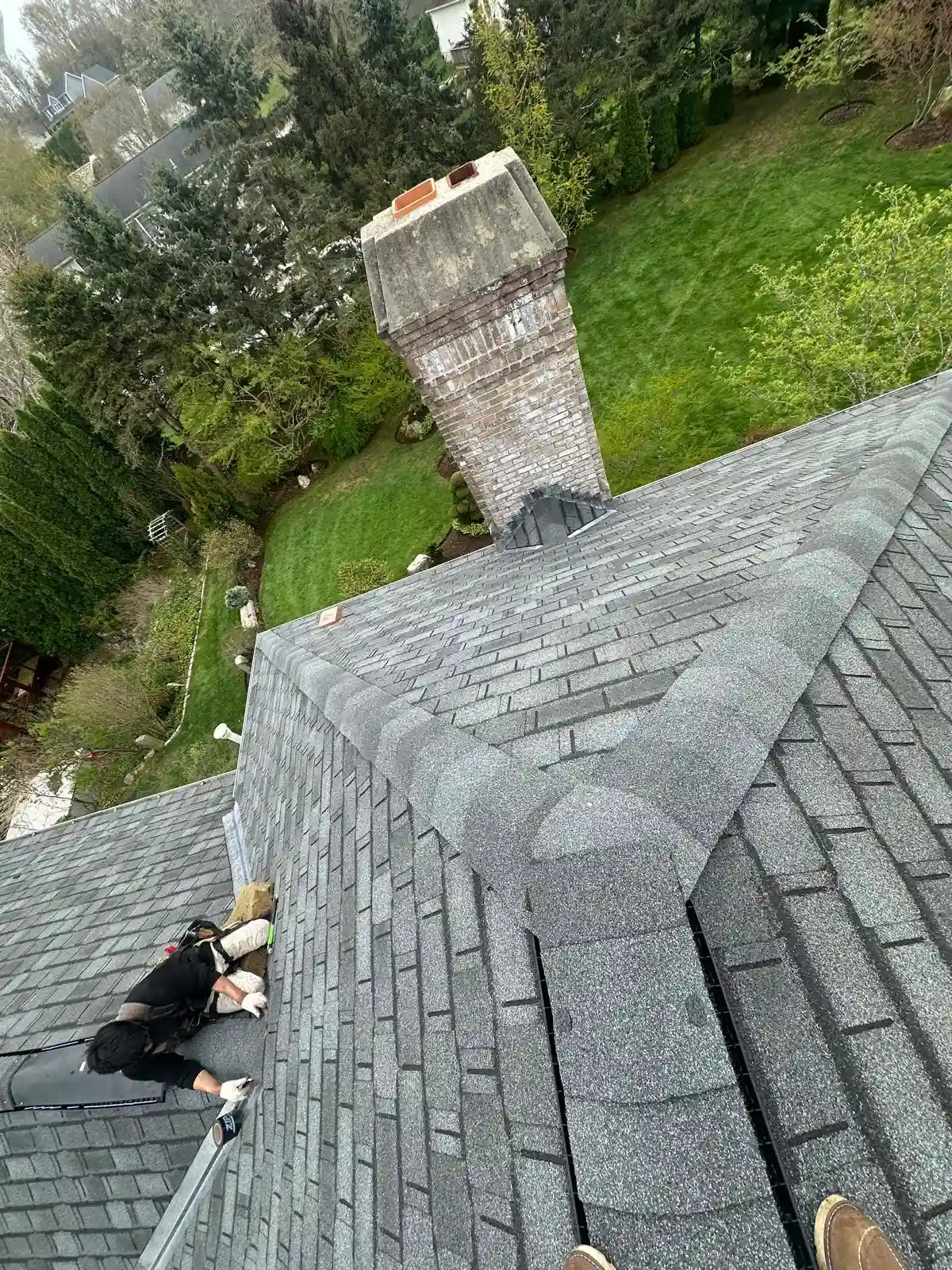 New roof installation in progress on a Rhode Island home